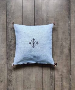 Sky blue Moroccan kilim pillow cover with a single woven Berber motif