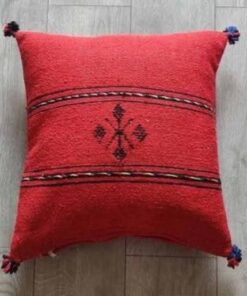 Handwoven Moroccan kilim pillow cover in red with Berber motif and pompom corners