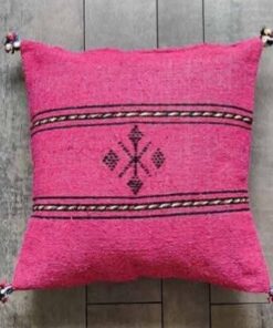 Handwoven Moroccan kilim pillow cover in pink with Berber motif and pompom corners