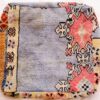 One-of-a-kind vintage Moroccan rug floor pouf in lavender blue with coral medallions and a cream Berber border