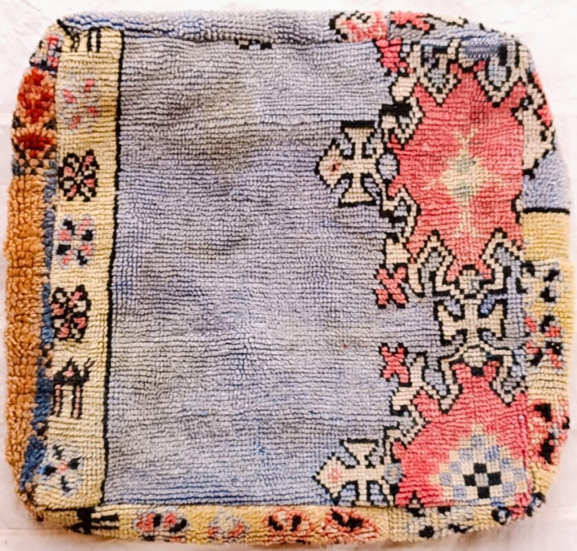 One-of-a-kind vintage Moroccan rug floor pouf in lavender blue with coral medallions and a cream Berber border