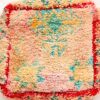 One-of-a-kind vintage Moroccan shag rug floor pouf in blush pink and cream with turquoise motifs and a red border