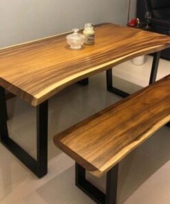 Live-edge walnut dining table with black steel legs and matching bench