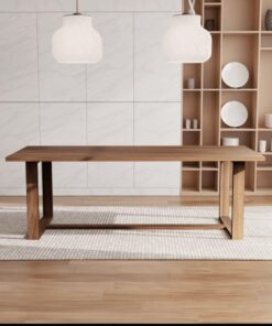 Walnut dining table with black steel legs under pendant lights
