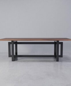 Walnut table on a black steel H-frame