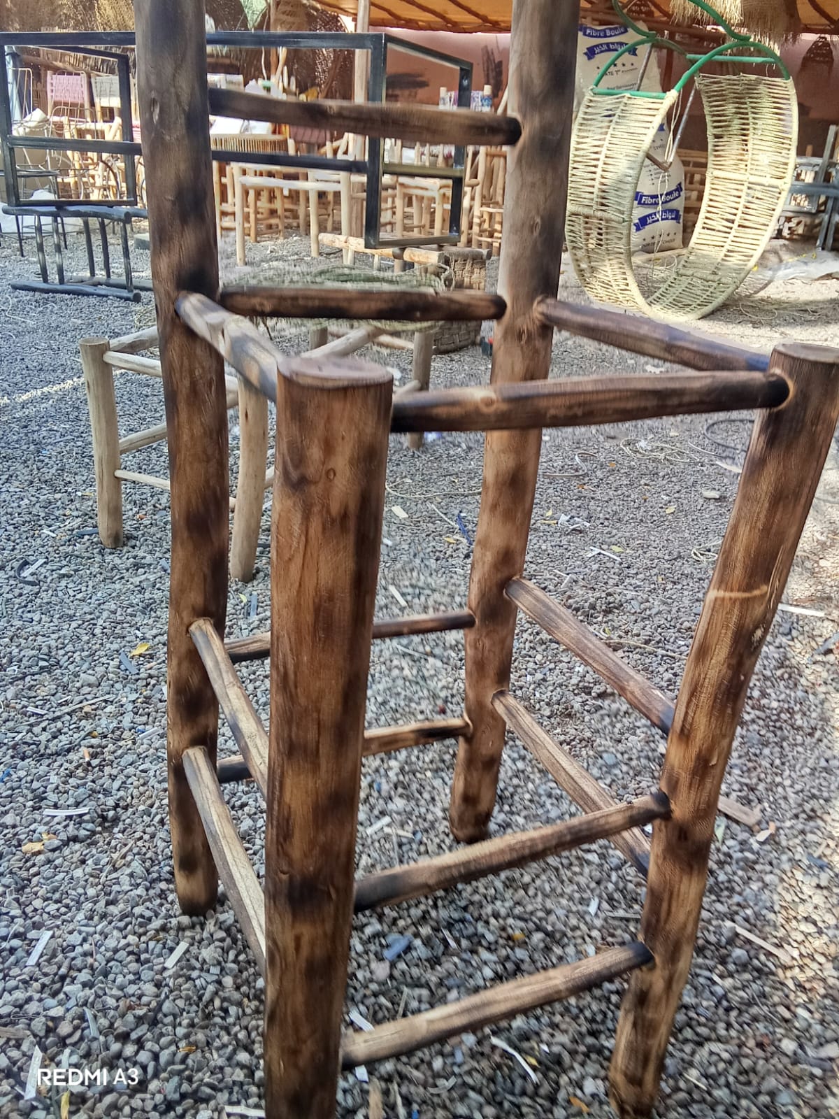 Handmade eucalyptus bar stools in the Marrakech workshop