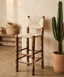 Eucalyptus bar stool with cream woven cord seat next to a cactus
