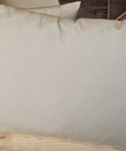 Beige outdoor cushion on a rattan chair seat pad