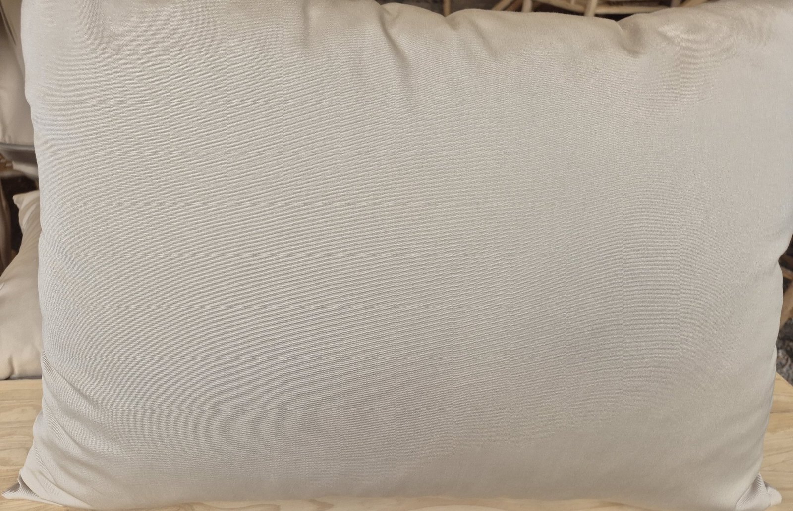 Black and white awning stripe outdoor cushions on a wooden table