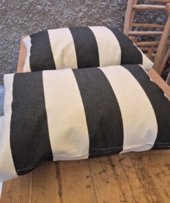 Pair of black and white striped outdoor cushions