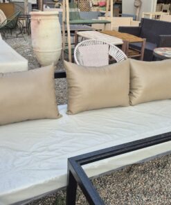 Taupe faux leather outdoor cushions on a black metal garden sofa