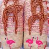 Moroccan straw basket bags embroidered with pink flamingos