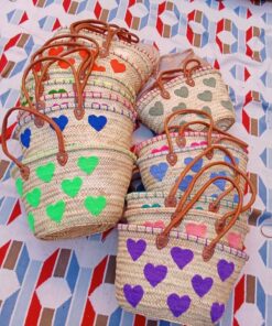 Moroccan straw basket bags embroidered with colourful fluffy hearts