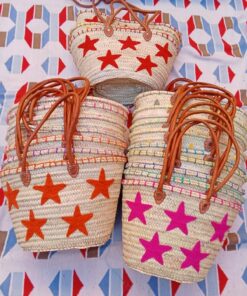 Moroccan straw basket bags embroidered with red, orange and pink stars