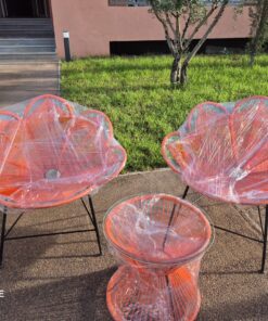 Orange petal-back rope chairs and glass-top rope side table, freshly made in the Marrakech workshop